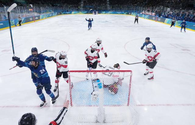 (260211) -- MILAN, Feb. 11, 2026 (Xinhua) -- Players of Finland (L) celebrate a goal during the ice hockey women's preliminary round group A match between Finland and Switzerland of the Milan-Cortina 2026 Olympic Winter Games in Milan, Italy, Feb. 10, 2026. (Xinhua/Wang Kaiyan)