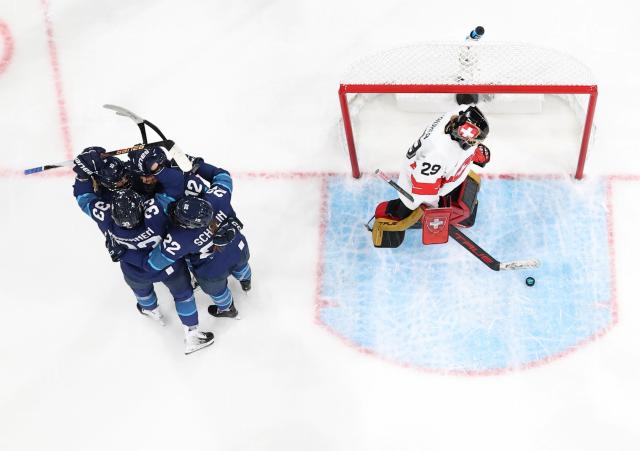 (260211) -- MILAN, Feb. 11, 2026 (Xinhua) -- Players of Finland (L) celebrate a goal during the ice hockey women's preliminary round group A match between Finland and Switzerland of the Milan-Cortina 2026 Olympic Winter Games in Milan, Italy, Feb. 10, 2026. (Xinhua/Wang Kaiyan)