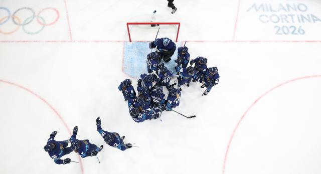 (260211) -- MILAN, Feb. 11, 2026 (Xinhua) -- Players of Finland celebrate victory after the ice hockey women's preliminary round group A match between Finland and Switzerland of the Milan-Cortina 2026 Olympic Winter Games in Milan, Italy, Feb. 10, 2026. (Xinhua/Wang Kaiyan)