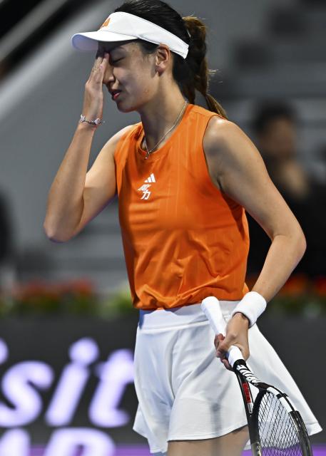 (260211) -- DOHA, Feb. 11, 2026 (Xinhua) -- Wang Xinyu of China reacts during the women's singles round of 32 match between Wang Xinyu of China and Elena Rybakina of Kazakhstan at the WTA Qatar Open 2026 tennis tournament in Doha, Qatar, on Feb. 10, 2026. (Photo by Nikku/Xinhua)