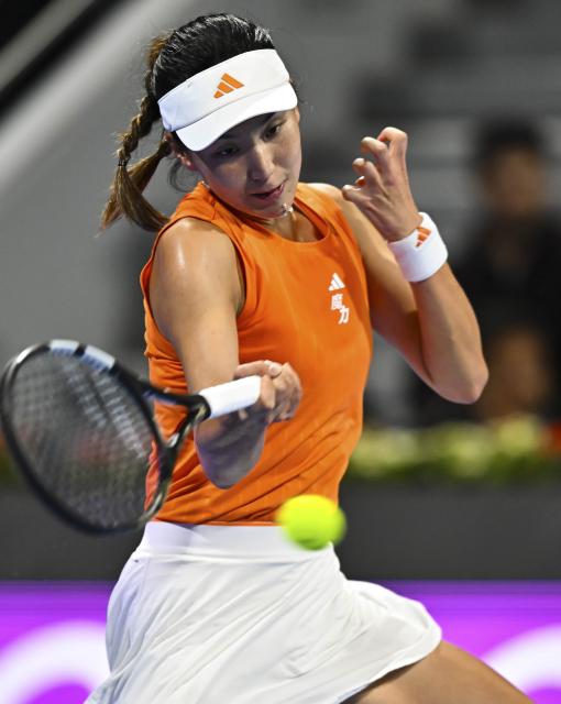 (260211) -- DOHA, Feb. 11, 2026 (Xinhua) -- Wang Xinyu of China hits a return during the women's singles round of 32 match between Wang Xinyu of China and Elena Rybakina of Kazakhstan at the WTA Qatar Open 2026 tennis tournament in Doha, Qatar, on Feb. 10, 2026. (Photo by Nikku/Xinhua)