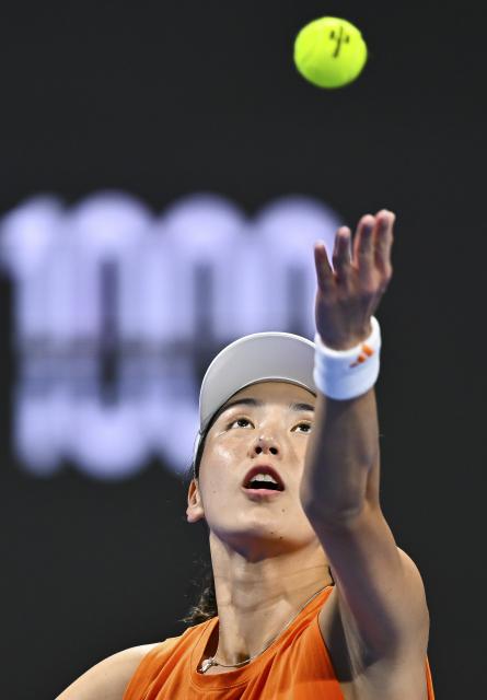 (260211) -- DOHA, Feb. 11, 2026 (Xinhua) -- Wang Xinyu of China serves during the women's singles round of 32 match between Wang Xinyu of China and Elena Rybakina of Kazakhstan at the WTA Qatar Open 2026 tennis tournament in Doha, Qatar, on Feb. 10, 2026. (Photo by Nikku/Xinhua)