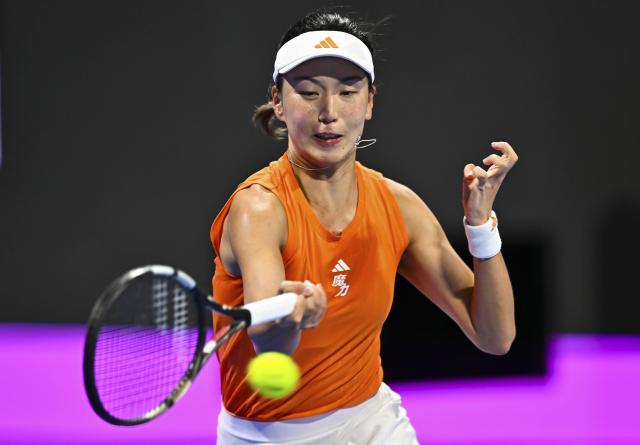 (260211) -- DOHA, Feb. 11, 2026 (Xinhua) -- Wang Xinyu of China hits a return during the women's singles round of 32 match between Wang Xinyu of China and Elena Rybakina of Kazakhstan at the WTA Qatar Open 2026 tennis tournament in Doha, Qatar, on Feb. 10, 2026. (Photo by Nikku/Xinhua)