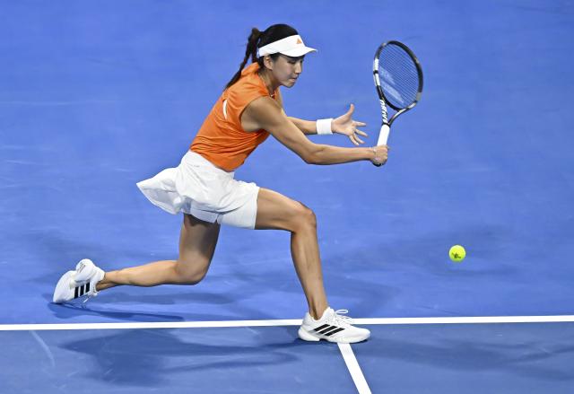(260211) -- DOHA, Feb. 11, 2026 (Xinhua) -- Wang Xinyu of China hits a return during the women's singles round of 32 match between Wang Xinyu of China and Elena Rybakina of Kazakhstan at the WTA Qatar Open 2026 tennis tournament in Doha, Qatar, on Feb. 10, 2026. (Photo by Nikku/Xinhua)