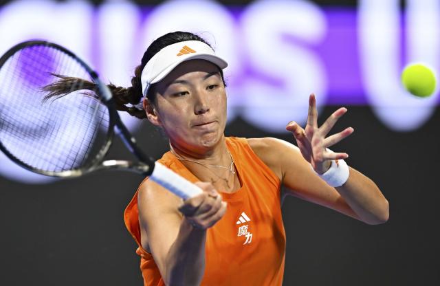 (260211) -- DOHA, Feb. 11, 2026 (Xinhua) -- Wang Xinyu of China hits a return during the women's singles round of 32 match between Wang Xinyu of China and Elena Rybakina of Kazakhstan at the WTA Qatar Open 2026 tennis tournament in Doha, Qatar, on Feb. 10, 2026. (Photo by Nikku/Xinhua)