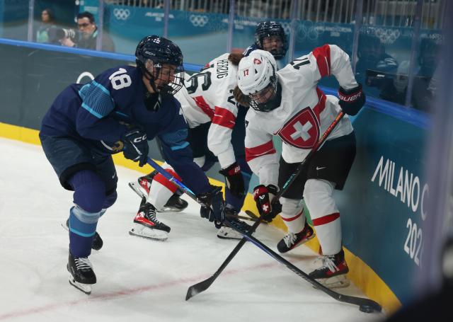 (260211) -- MILAN, Feb. 11, 2026 (Xinhua) -- Jenniina Nylund (L) of Finland vies with Lara Christen of Switzerland during the ice hockey women's preliminary round group A match between Finland and Switzerland of the Milan-Cortina 2026 Olympic Winter Games in Milan, Italy, Feb. 10, 2026. (Xinhua/Wang Kaiyan)