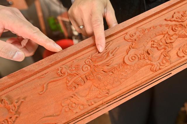 (260211) -- DONGXING, Feb. 11, 2026 (Xinhua) -- Su Haizhen discusses with her husband on the making skills of Duxianqin in Dongxing City, south China's Guangxi Zhuang Autonomous Region, Feb. 7, 2026. On Jintan Beach in Dongxing City of south China's Guangxi Zhuang Autonomous Region, Su Haizhen plays the Duxianqin, or single-stringed musical instrument, showcasing the unique charm of the Jing ethnic group's special instrument.
   The Jing people are among China's smaller ethnic minority groups, and the only one whose economy is primarily based on marine fishing. They mainly reside in Dongxing City of Guangxi. Duxianqin is a distinctive ethnic instrument of Dongxing's Jing community. With just one string and one lever, it can produce six registers and three octaves. In 2011, the Duxianqin art of Jing people was listed as one of the national intangible cultural heritages in China. 
   Su Haizhen, a Jing native from Dongxing who grew up by the sea, comes from a family that has been dedicated to preserving Jing culture since her grandfather's generation. In 1987, she began formally studying to play the Duxianqin. Today, she is a regional-level representative inheritor of the Duxianqin art of Jing people in the autonomous region. Over nearly four decades of research, inheriting, and development of the instrument, Su has been continuously refining her playing skills while improving the instrument's craftsmanship and exploring innovative performance styles. She is also committed to nurturing more enthusiasts and inheritors of the art.
   In 2023, after becoming a member of the National Committee of the Chinese People's Political Consultative Conference, Su Haizhen felt a stronger sense of mission and responsibility to preserve and promote China's traditional culture. While advocating for Duxianqin education in schools, she has been exploring ways to further highlight the cultural appeal of the art. Leveraging Dongxing's geographical proximity to Vietnam, she aims to foster deeper cultural exchanges and cooperation between China and ASEAN countries like Vietnam. (Xinhua/Lu Boan)