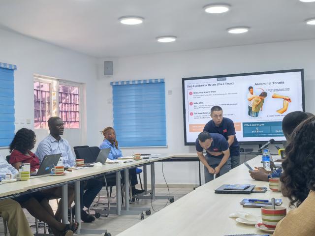 (260211) -- FREETOWN, Feb. 11, 2026 (Xinhua) -- Members of the 26th batch of Chinese medical team demonstrate Heimlich maneuver to the United Nations Children's Fund (UNICEF) Sierra Leone staff in Freetown, Sierra Leone on Feb. 9, 2026. The 26th batch of Chinese medical team provided an on-site first aid training program for the United Nations Children's Fund (UNICEF) Sierra Leone staff at the UNICEF Head Office in Freetown on Monday. (The 26th batch of the Chinese medical team to Sierra Leone/Handout via Xinhua)