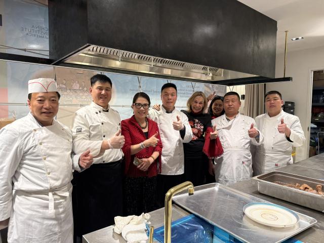 (260211) -- NEW YORK, Feb. 11, 2026 (Xinhua) -- Master chefs from Beijing pose for a group photo with the staff of China Institute of America during a Chinese New Year banquet held in Lower Manhattan, New York City, the United States, on Feb. 9, 2026. TO GO WITH "Feature: Chinese New Year banquet in New York celebrates culinary heritage, cross-cultural connections" (Photo by Vivien Liu/Xinhua)