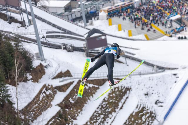 (260211) -- PREDAZZO, Feb. 11, 2026 (Xinhua) -- Zhao Jiawen of China competes during the Nordic Combined Individual Gundersen Normal Hill/10km at the 2026 Milan-Cortina Winter Olympics in Predazzo, Italy, Feb. 11, 2026. (Xinhua/Huang Wei)