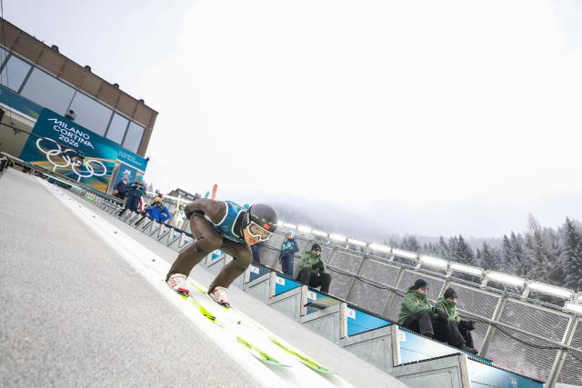 (260211) -- PREDAZZO, Feb. 11, 2026 (Xinhua) -- Zhao Jiawen of China competes during the Nordic Combined Individual Gundersen Normal Hill/10km at the 2026 Milan-Cortina Winter Olympics in Predazzo, Italy, Feb. 11, 2026. (Xinhua/Huang Wei)