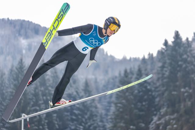 (260211) -- PREDAZZO, Feb. 11, 2026 (Xinhua) -- Zhao Zihe of China competes during the Nordic Combined Individual Gundersen Normal Hill/10km at the 2026 Milan-Cortina Winter Olympics in Predazzo, Italy, Feb. 11, 2026. (Xinhua/Huang Wei)
