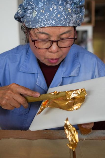 (260211) -- NANJING, Feb. 11, 2026 (Xinhua) -- A worker deals with gold foil products at Jinling Goldfoil Group Co., Ltd. in Nanjing, east China's Jiangsu Province, Feb. 10, 2026. In China, gold foil is widely used as decoration for architectures and also for sculptures, craftworks, food and clothes. 
    Forging gold foil, a traditional craft in Nanjing, has a long history. The making has to go through a dozen of procedures. The gold foil produced here is famous for its pure color and luster, smooth and filmy thickness.
    In 2006, Nanjing's gold foil making technique was inscribed on China's national list of intangible cultural heritage.
    With the approach of the Year of the Horse, the gold foil manufacturers in Nanjing have incorporated elements of the zodiac horse into its designs. (Xinhua/Li Bo)