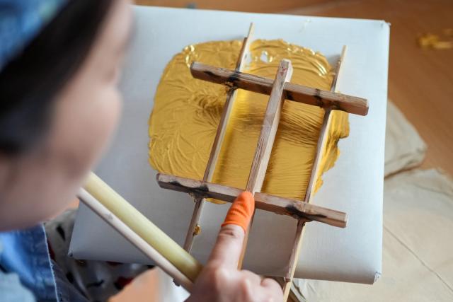 (260211) -- NANJING, Feb. 11, 2026 (Xinhua) -- A worker cuts gold foil products at Jinling Goldfoil Group Co., Ltd. in Nanjing, east China's Jiangsu Province, Feb. 10, 2026. In China, gold foil is widely used as decoration for architectures and also for sculptures, craftworks, food and clothes. 
    Forging gold foil, a traditional craft in Nanjing, has a long history. The making has to go through a dozen of procedures. The gold foil produced here is famous for its pure color and luster, smooth and filmy thickness.
    In 2006, Nanjing's gold foil making technique was inscribed on China's national list of intangible cultural heritage.
    With the approach of the Year of the Horse, the gold foil manufacturers in Nanjing have incorporated elements of the zodiac horse into its designs. (Xinhua/Li Bo)