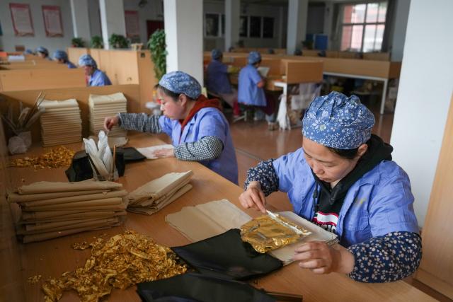 (260211) -- NANJING, Feb. 11, 2026 (Xinhua) -- Workers process gold foil products at Jinling Goldfoil Group Co., Ltd. in Nanjing, east China's Jiangsu Province, Feb. 10, 2026. In China, gold foil is widely used as decoration for architectures and also for sculptures, craftworks, food and clothes. 
    Forging gold foil, a traditional craft in Nanjing, has a long history. The making has to go through a dozen of procedures. The gold foil produced here is famous for its pure color and luster, smooth and filmy thickness.
    In 2006, Nanjing's gold foil making technique was inscribed on China's national list of intangible cultural heritage.
    With the approach of the Year of the Horse, the gold foil manufacturers in Nanjing have incorporated elements of the zodiac horse into its designs. (Xinhua/Li Bo)