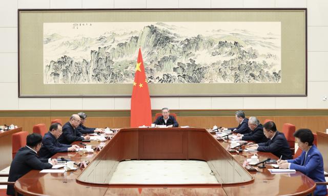 (260211) -- BEIJING, Feb. 11, 2026 (Xinhua) -- Chinese Premier Li Qiang presides over a State Council group study session focused on artificial intelligence (AI) development on Feb. 11, 2026. Li on Wednesday called for a comprehensive push in the technological innovation, industrial growth and application of AI to foster new quality productive forces and promote high-quality development. (Xinhua/Huang Jingwen)