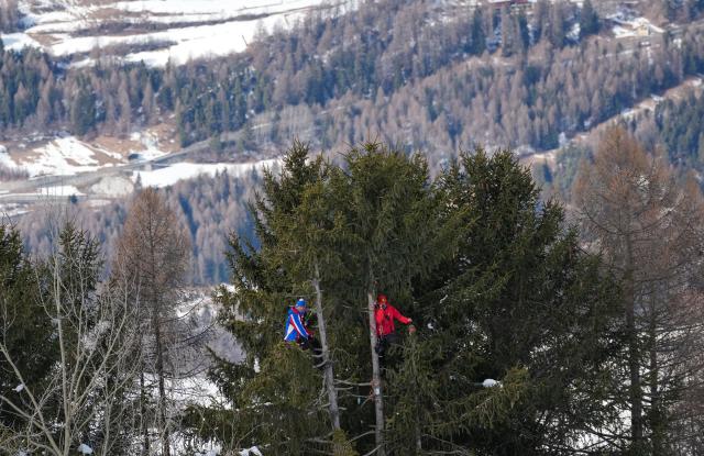(260211) -- BORMIO, Feb. 11, 2026 (Xinhua) -- Two coaches watches the alpine skiing men's Super-G at the Milan-Cortina 2026 Olympic Winter Games in Bormio, Italy, Feb. 11, 2026. (Xinhua/Hu Huhu)