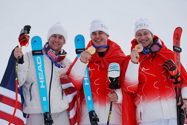 (260211) -- BORMIO, Feb. 11, 2026 (Xinhua) -- Gold medalist Franjo von Allmen (C) of Switzerland, silver medalist Ryan Cochran-Siegle (L) of the United States and bronze medalist Marco Odermatt of Switzerland pose during the awarding ceremony for the alpine skiing men's Super-G at the Milan-Cortina 2026 Olympic Winter Games in Bormio, Italy, Feb. 11, 2026. (Xinhua/Yan Linyun)