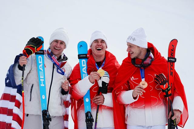(260211) -- BORMIO, Feb. 11, 2026 (Xinhua) -- Gold medalist Franjo von Allmen (C) of Switzerland, silver medalist Ryan Cochran-Siegle (L) of the United States and bronze medalist Marco Odermatt of Switzerland pose during the awarding ceremony for the alpine skiing men's Super-G at the Milan-Cortina 2026 Olympic Winter Games in Bormio, Italy, Feb. 11, 2026. (Xinhua/Yan Linyun)