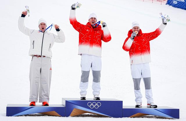 (260211) -- BORMIO, Feb. 11, 2026 (Xinhua) -- Gold medalist Franjo von Allmen (C) of Switzerland, silver medalist Ryan Cochran-Siegle (L) of the United States and bronze medalist Marco Odermatt of Switzerland react during the awarding ceremony for the alpine skiing men's Super-G at the Milan-Cortina 2026 Olympic Winter Games in Bormio, Italy, Feb. 11, 2026. (Xinhua/Yan Linyun)