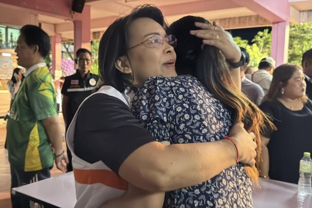 (260211) -- BANGKOK, Feb. 11, 2026 (Xinhua) -- Two women hug each other at the school where a shooting took place in the Hat Yai district of Songkhla province, Thailand, Feb. 11, 2026. Thai police confirmed on Wednesday that a gunman has been taken into custody following a school shooting earlier Wednesday in the southern province of Songkhla. (Xinhua)