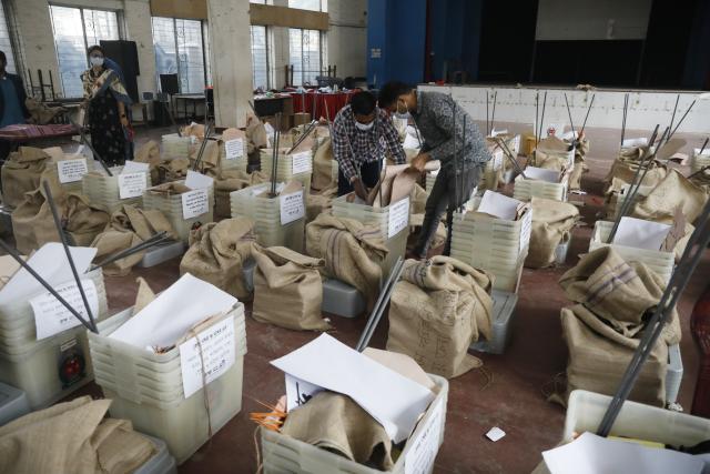 (260211) -- DHAKA, Feb. 11, 2026 (Xinhua) -- Staff members check ballot boxes ahead of the general election in Dhaka, Bangladesh, Feb. 11, 2026. Bangladesh is all set for Thursday's general elections in which more than 127 million voters are expected to cast their ballots at over 42,000 polling stations across the country, a senior official said Tuesday. (Photo by Habibur Rahman/Xinhua)