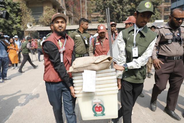 (260211) -- DHAKA, Feb. 11, 2026 (Xinhua) -- Staff members carry ballot boxes ahead of the general election in Dhaka, Bangladesh, Feb. 11, 2026. Bangladesh is all set for Thursday's general elections in which more than 127 million voters are expected to cast their ballots at over 42,000 polling stations across the country, a senior official said Tuesday. (Photo by Habibur Rahman/Xinhua)