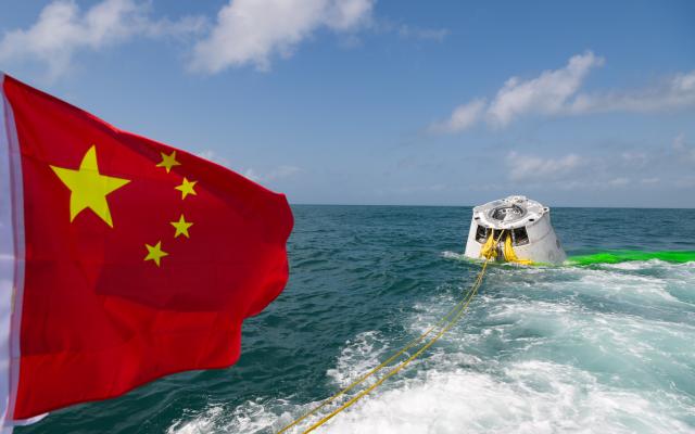 (260211) -- WENCHANG, Feb. 11, 2026 (Xinhua) -- This photo taken on Feb. 11, 2026 shows the return capsule of China's new-generation Mengzhou crewed spaceship in the predetermined sea area during a flight test. A low-altitude demonstration and verification flight test for the Long March-10 carrier rocket and a maximum dynamic pressure abort flight test for the new-generation crewed spaceship system Mengzhou are successfully conducted at the Wenchang Spacecraft Launch Site in south China's Hainan Province on Wednesday. (Xinhua/Yang Guanyu)