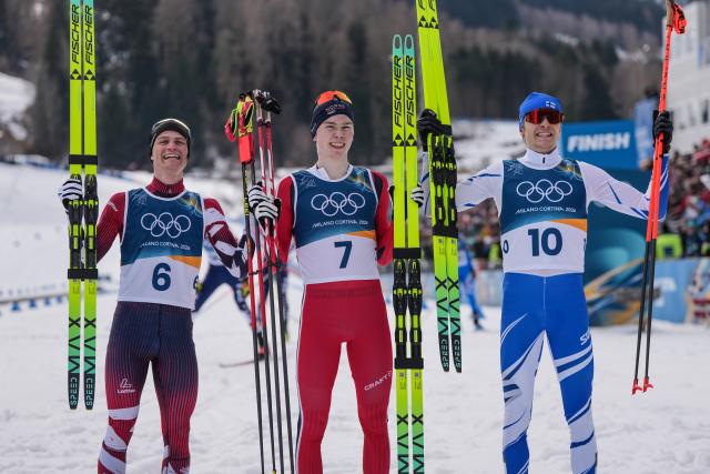 (260211) -- TESERO, Feb. 11, 2026 (Xinhua) -- Gold medalist Jens Luraas Oftebro (C) of Norway, silver medalist Johannes Lamparter (L) of Austria and bronze medalist Eero Hirvonen of Finland pose for a photo after the Cross-Country competition of Nordic Combined Individual Gundersen Normal Hill/10km at the Milan-Cortina 2026 Olympic Winter Games in Tesero, Italy, Feb. 11, 2026. (Xinhua/Peng Ziyang)