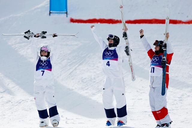 (260211) -- LIVIGNO, Feb. 11, 2026 (Xinhua) -- Gold medalist Elizabeth Lemley (C) of the United States, silver medalist Jaelin Kauf (L) of the United States and bronze medalist Perrine Laffont of France celebrate after the freestyle skiing women's moguls final at the Milan-Cortina 2026 Olympic Winter Games in Livigno, Italy, Feb. 11, 2026. (Xinhua/Wang Peng)