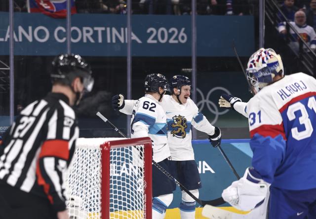 (260211) -- MILAN, Feb. 11, 2026 (Xinhua) -- Players of Finland celebrate scoring during the ice hockey men's preliminary round group B match between Finland and Slovakia at the Milan-Cortina 2026 Olympic Winter Games in Milan, Italy, Feb. 11, 2026. (Xinhua/Wang Kaiyan)