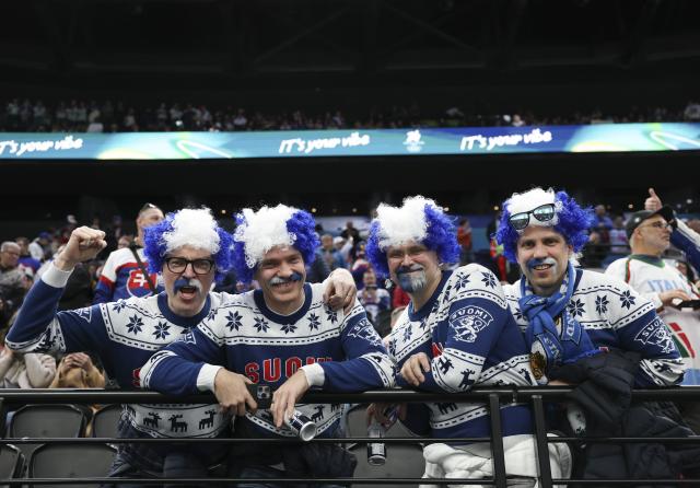 (260211) -- MILAN, Feb. 11, 2026 (Xinhua) -- Fans of Finland pose before the ice hockey men's preliminary round group B match between Finland and Slovakia at the Milan-Cortina 2026 Olympic Winter Games in Milan, Italy, Feb. 11, 2026. (Xinhua/Wang Kaiyan)