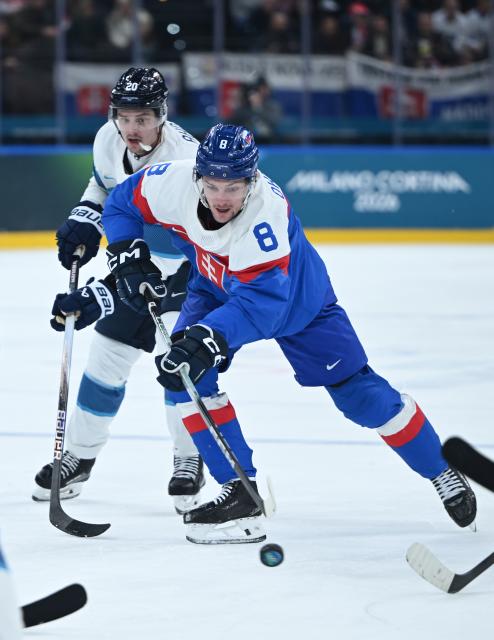 (260211) -- MILAN, Feb. 11, 2026 (Xinhua) -- Oliver Okuliar (R) of Slovakia competes during the ice hockey men's preliminary round group B match between Finland and Slovakia at the Milan-Cortina 2026 Olympic Winter Games in Milan, Italy, Feb. 11, 2026. (Xinhua/Zhang Haofu)