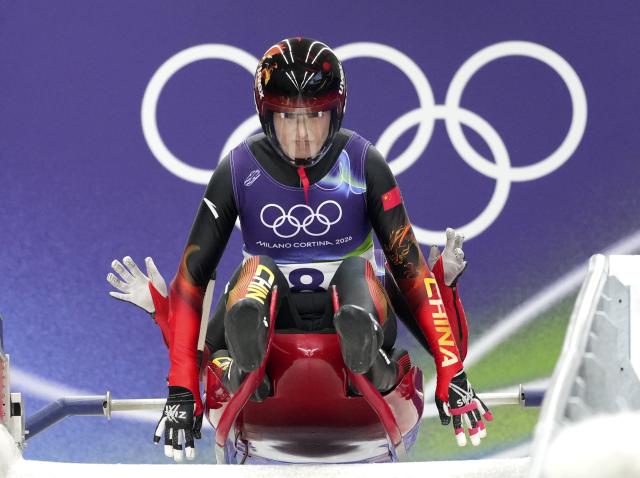 (260211) -- CORTINA D'AMPEZZO, Feb. 11, 2026 (Xinhua) -- Zhao Jiaying/Gulijienaiti Adikeyoumu (front) of China compete during the luge women's doubles run 1 at the Milan-Cortina 2026 Olympic Winter Games in Cortina, Italy, Feb. 11, 2026. (Xinhua/Li Gang)
