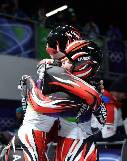 (260211) -- CORTINA D'AMPEZZO, Feb. 11, 2026 (Xinhua) -- Selina Egle/Lara Michael Kipp of Austria celebrate after the luge women's doubles match at the Milan-Cortina 2026 Olympic Winter Games in Cortina, Italy, Feb. 11, 2026. (Xinhua/Ding Xu)