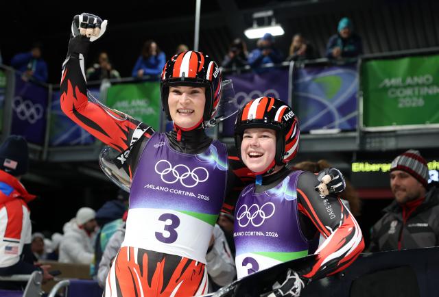 (260211) -- CORTINA D'AMPEZZO, Feb. 11, 2026 (Xinhua) -- Selina Egle/Lara Michael Kipp of Austria celebrate after the luge women's doubles match at the Milan-Cortina 2026 Olympic Winter Games in Cortina, Italy, Feb. 11, 2026. (Xinhua/Ding Xu)