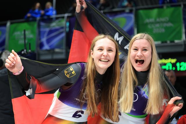 (260211) -- CORTINA D'AMPEZZO, Feb. 11, 2026 (Xinhua) -- Magdalena Matschina (L)/Dajana Eitberger of Germany celebrate after the luge women's doubles run 2 at the Milan-Cortina 2026 Olympic Winter Games in Cortina, Italy, Feb. 11, 2026. (Xinhua/Ding Xu)