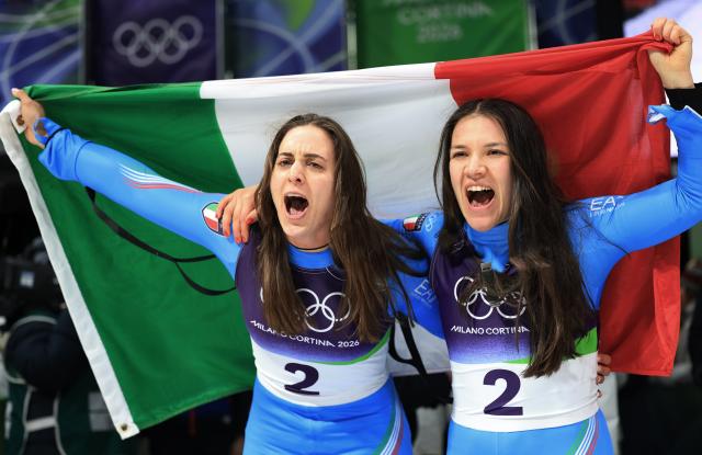 (260211) -- CORTINA D'AMPEZZO, Feb. 11, 2026 (Xinhua) -- Andrea Voetter(L)/Marion Oberhofer of Italy celebrate after the luge women's doubles run 2 at the Milan-Cortina 2026 Olympic Winter Games in Cortina, Italy, Feb. 11, 2026. (Xinhua/Ding Xu)
