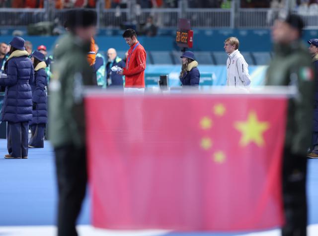 (260212) -- MILAN, Feb. 12, 2026 (Xinhua) -- Ning Zhongyan of China attends the awarding ceremony of the speed skating men's 1000m match at the Milan-Cortina 2026 Olympic Winter Games in Milan, Italy, Feb. 11, 2026. (Xinhua/Du Xiaoyi)
