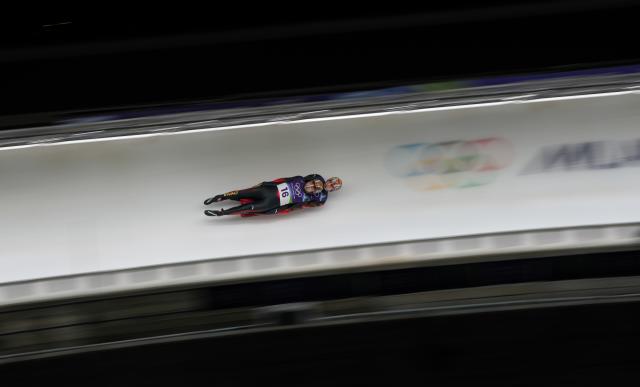 (260212) -- CORTINA D'AMPEZZO, Feb. 12, 2026 (Xinhua) -- Jubayi Saikeyi/Hou Shuo of China compete during of the luge men's doubles run 2 at the Milan-Cortina 2026 Olympic Winter Games in Cortina, Italy, Feb. 11, 2026. (Xinhua/Li Gang)