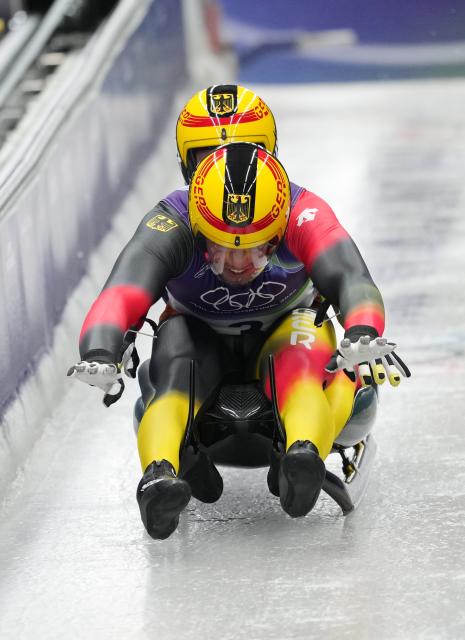 (260211) -- CORTINA D'AMPEZZO, Feb. 11, 2026 (Xinhua) -- Tobias Wendl/Tobias Arlt of Germany compete during of the luge men's doubles run 1 at the Milan-Cortina 2026 Olympic Winter Games in Cortina, Italy, Feb. 11, 2026. (Xinhua/Li Gang)