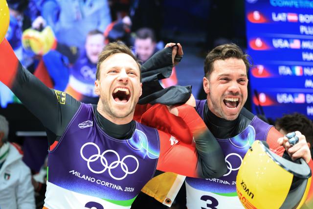 (260211) -- CORTINA D'AMPEZZO, Feb. 11, 2026 (Xinhua) -- Tobias Wendl/Tobias Arlt of Germany celebrate after of the luge men's doubles match at the Milan-Cortina 2026 Olympic Winter Games in Cortina, Italy, Feb. 11, 2026. (Xinhua/Ding Xu)