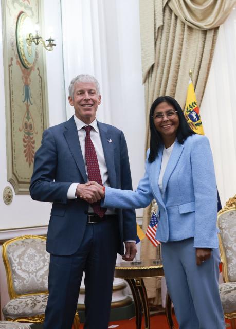 (260211) -- CARACAS, Feb. 11, 2026 (Xinhua) -- Venezuela's acting president Delcy Rodriguez (R) meets with U.S. Energy Secretary Chris Wright in Caracas, Venezuela, on Feb. 11, 2026. Rodriguez met with U.S. Energy Secretary Chris Wright at the Miraflores Palace on Wednesday to review the bilateral energy agenda. (Venezuelan Presidency/Handout via Xinhua)