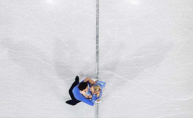 (260212) -- MILAN, Feb. 12, 2026 (Xinhua) -- Piper Gilles/Paul Poirier of Canada compete during the free dance of figure skating ice dance competition at the Milan-Cortina 2026 Olympic Winter Games in Milan, Italy, Feb. 11, 2026. (Xinhua/Li Ming)