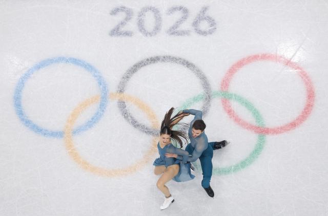 (260212) -- MILAN, Feb. 12, 2026 (Xinhua) -- Laurence Fournier Beaudry/Guillaume Cizeron (C) of France compete during the free dance of figure skating ice dance competition at the Milan-Cortina 2026 Olympic Winter Games in Milan, Italy, Feb. 11, 2026. (Xinhua/Li Ming)