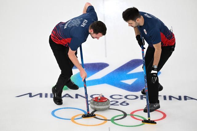 (260212) -- CORTINA D'AMPEZZO, Feb. 12, 2026 (Xinhua) -- Lukas Klipa (L) of the Czech Republic and Martin Jurik of the Czech Republic compete during the curling men round robin session 1 match between the Czech Republic and the United States at the 2026 Milan-Cortina Winter Olympics in Cortina D'Ampezzo, Italy, Feb. 11, 2026. (Xinhua/Lian Yi)
