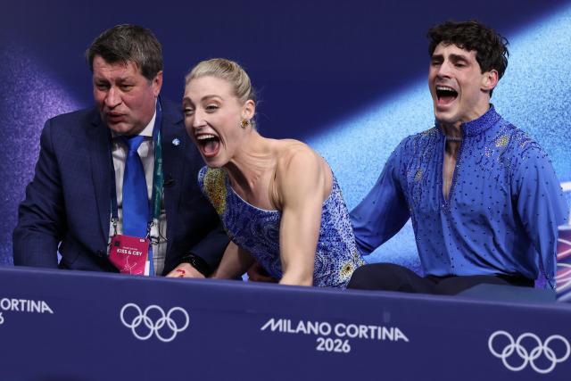 (260212) -- MILAN, Feb. 12, 2026 (Xinhua) -- Piper Gilles and Paul Poirier of Canada react as they wait for the scores during the free dance competition of figure skating ice dance at the Milan-Cortina 2026 Olympic Winter Games in Milan, Italy, Feb. 11, 2026. (Xinhua/Chen Yichen)
