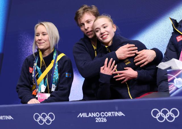 (260212) -- MILAN, Feb. 12, 2026 (Xinhua) -- Milla Ruud Reitan and Nikolaj Majorov of Sweden react as they wait for the scores during the free dance competition of figure skating ice dance at the Milan-Cortina 2026 Olympic Winter Games in Milan, Italy, Feb. 11, 2026. (Xinhua/Chen Yichen)