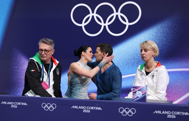 (260212) -- MILAN, Feb. 12, 2026 (Xinhua) -- Charlene Guignard and Marco Fabbri of Italy as they wait for the scores during the free dance competition of figure skating ice dance at the Milan-Cortina 2026 Olympic Winter Games in Milan, Italy, Feb. 11, 2026. (Xinhua/Chen Yichen)