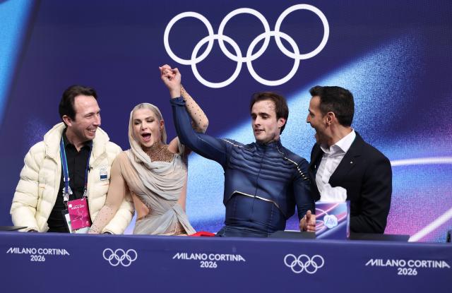 (260212) -- MILAN, Feb. 12, 2026 (Xinhua) -- Sofia Val and Asaf Kazimov of Spain react as they wait for the scores during the free dance competition of figure skating ice dance at the Milan-Cortina 2026 Olympic Winter Games in Milan, Italy, Feb. 11, 2026. (Xinhua/Chen Yichen)